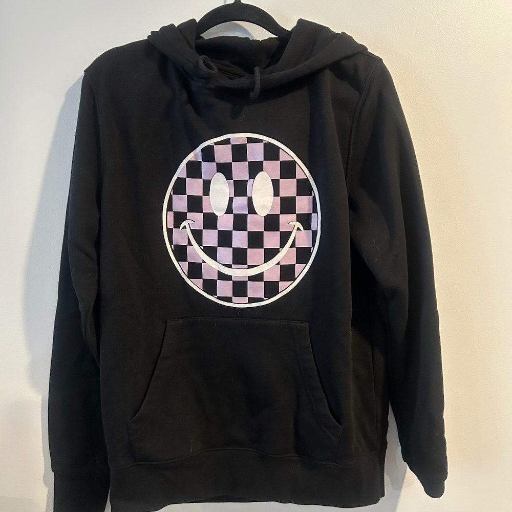 Black hoodie with light purple checkered Smiley face